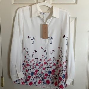 NWT white long sleeve flowy blouse. Floral accents. Button up. Womens Size M.